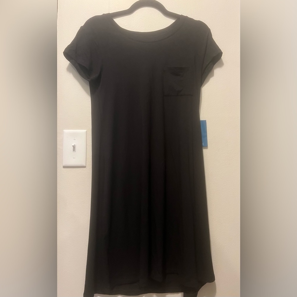 I’m selling a black t-shirt dress. It’s brand new, and still has the tags on it.